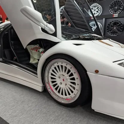 White exotic car · Motor show
