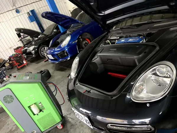 Engine bay inspection · Workshop photograph