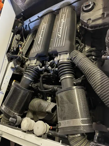 Engine bay inspection · Workshop photograph